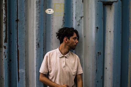 people photo of man wearing beige polo shirt person