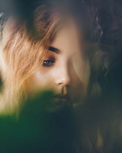 person portrait photography of woman near leaves people