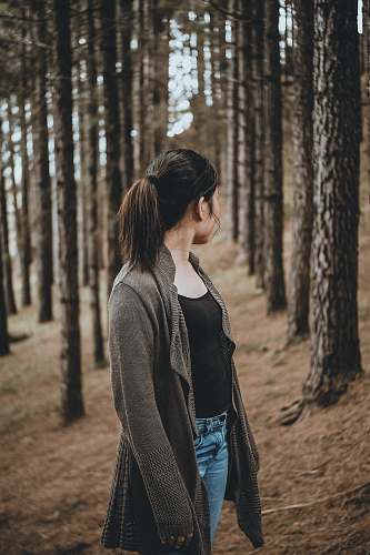 people selective focus photography of woman looking back person