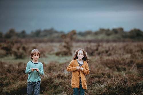 people shallow focus photography of children walking person