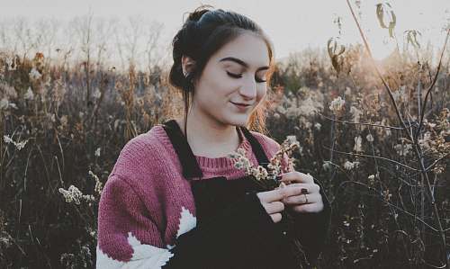people smiling woman holding flowers person