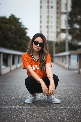 person unknown celebrity sitting outdoors people