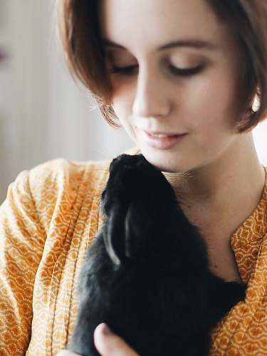 people woman carrying black dog person