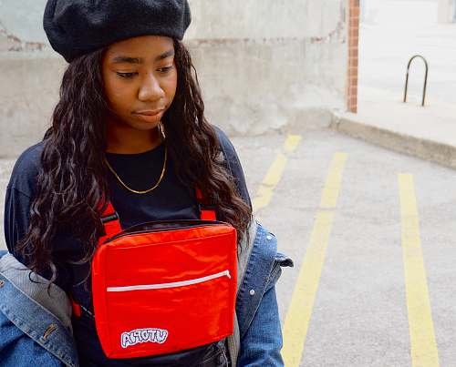 people woman carying red bag person