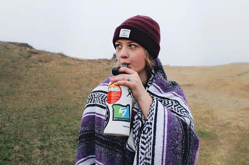people woman drinking on white bottle person