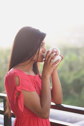 person woman drinking on white ceramic mug people