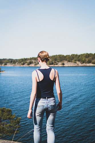 person woman fronting body of water people