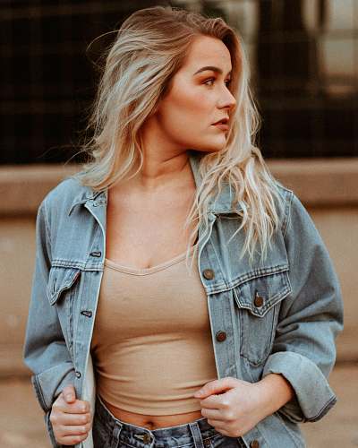 person woman holding hear denim jacket people