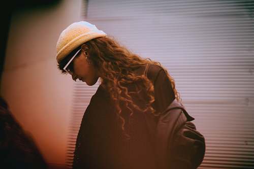 people woman in black top and wearing white hat person