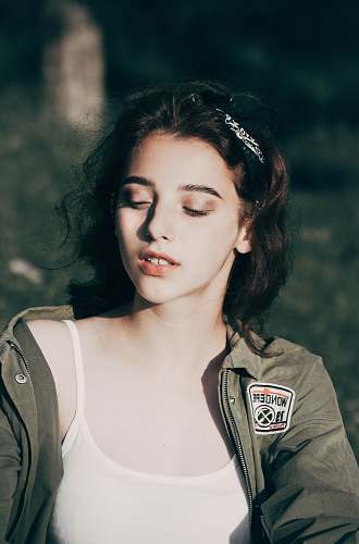 person woman in white camisole and gray leather jacket portrait photography people