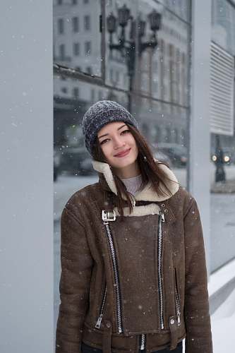 people woman leaning on wall taking selfie person