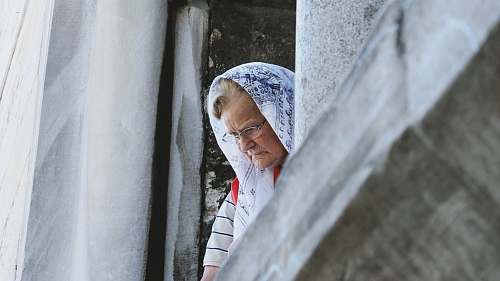 people woman peeking on window person