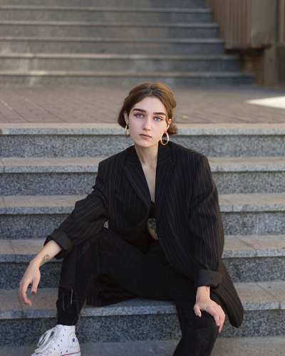person woman sittign on stairs people