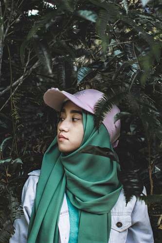 people woman standing between trees person