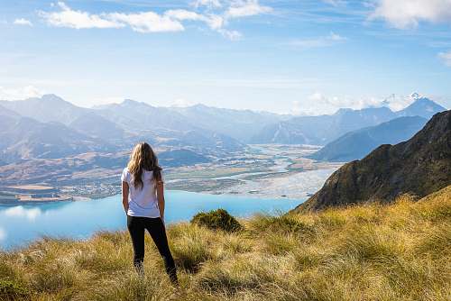 person woman standing front of body of water people