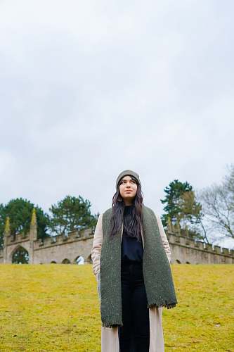 people woman standing looking up near castle person