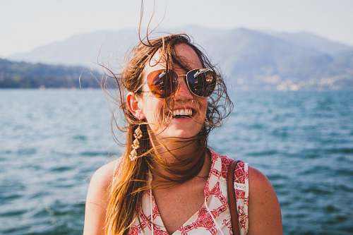 people woman standing near body of water person