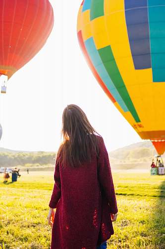 person woman standing near hot air balloon balloon