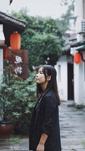 people woman standing near plants person
