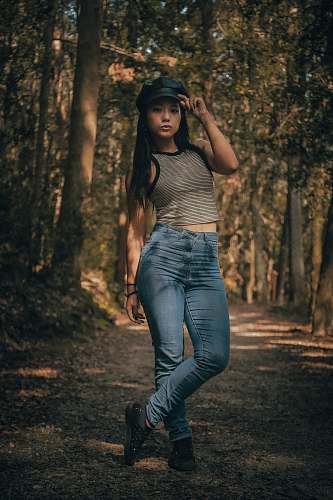people woman standing near the tree person