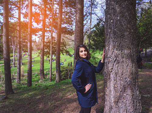 people woman standing near tree person