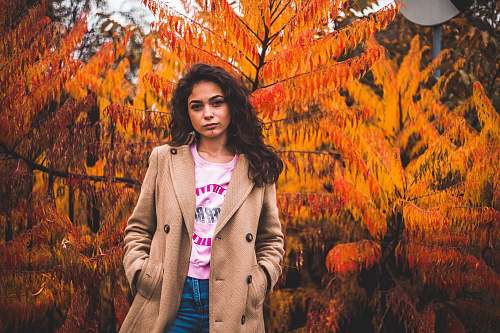 people woman standing near trees person