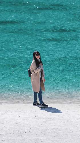 people woman standing on beach shore person