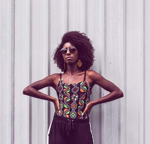 people woman standing with hands on her waist person