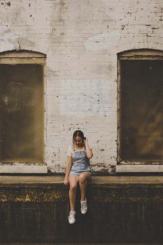 people woman wearing blue denim overall shorts person