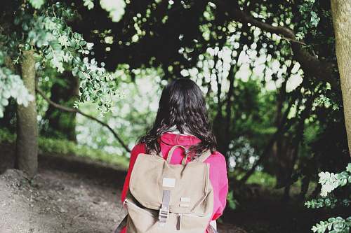 people woman wearing brown backpack person