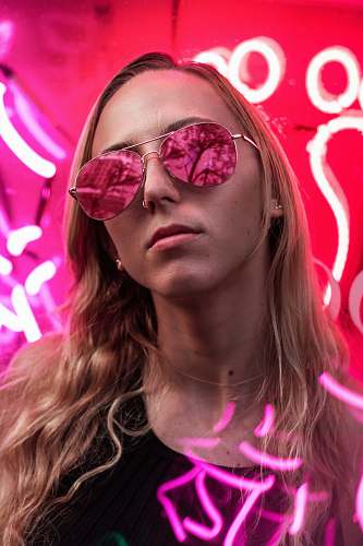 people woman wearing pink sunglasses with silver frames person