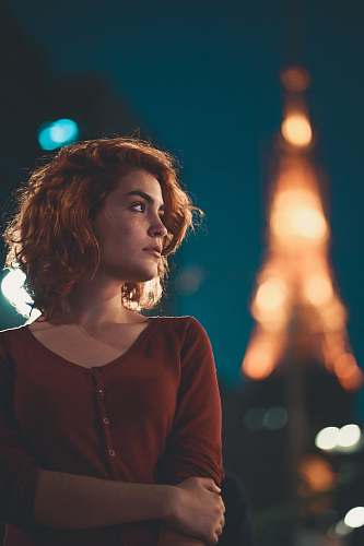 person woman wearing red sweater standing people