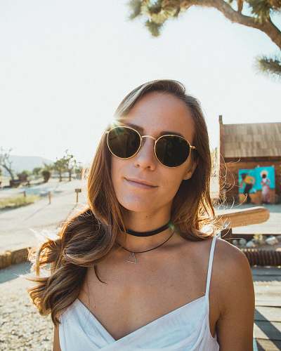 people woman wearing white cami top person
