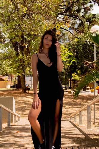 people women's black sleeveless dress person