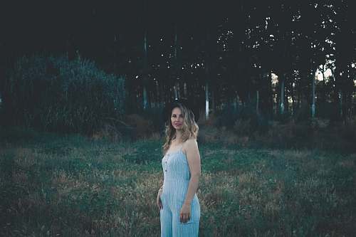 people women's white cami-strapped overalls person