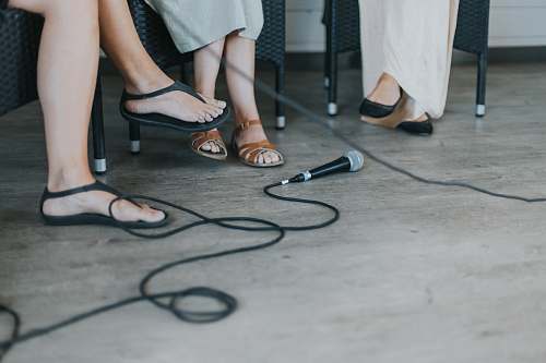 human black microphone on floor shoe