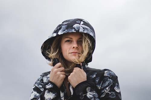 human close-up photography of woman wearing hoodie person