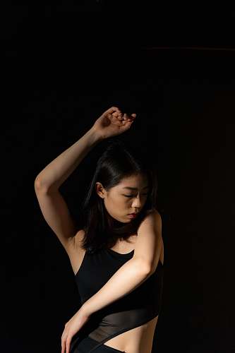 human dancing woman against black background dance
