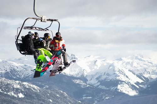 mountain four person riding cable car sport