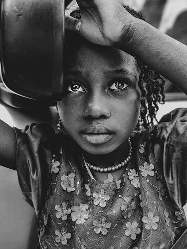 person girl holding bowl on grayscale photography black-and-white