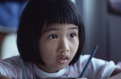 human girl holding pen girl