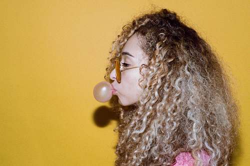 person girl making balloon using bubblegum human