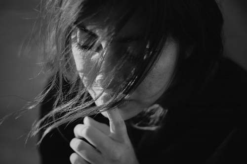 human grayscale photography of black top black-and-white