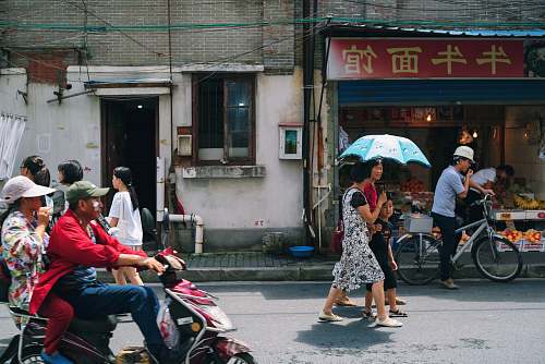 person group of people on street bike