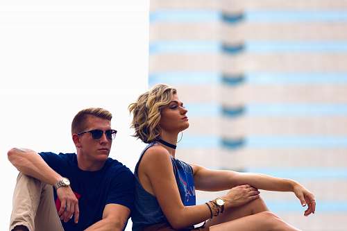 human man and woman sitting posing for photo person