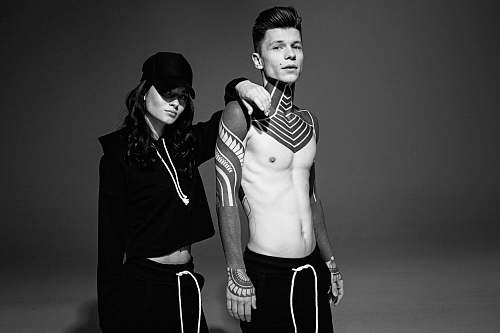 human man and woman standing beside each other black-and-white