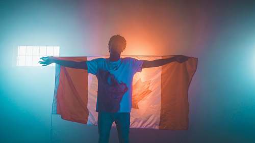 person man carrying Canada flag human