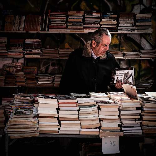 book man holding book near library greece