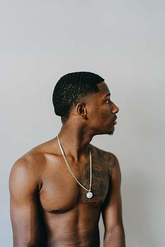 human man in silver-colored necklace person