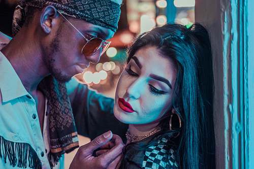 person man looking at woman leaning on wall human